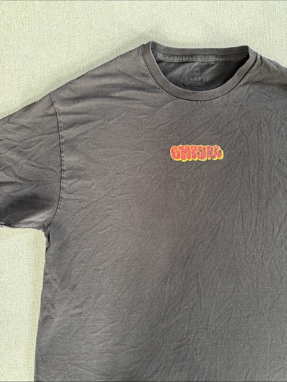 Empyre Black Short-Sleeve Crewneck Tee with Red and Yellow Chest Graphic
